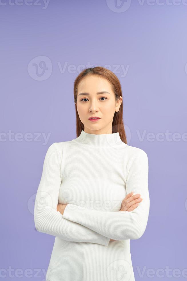 Young asian woman, smiling and crossed her arms photo