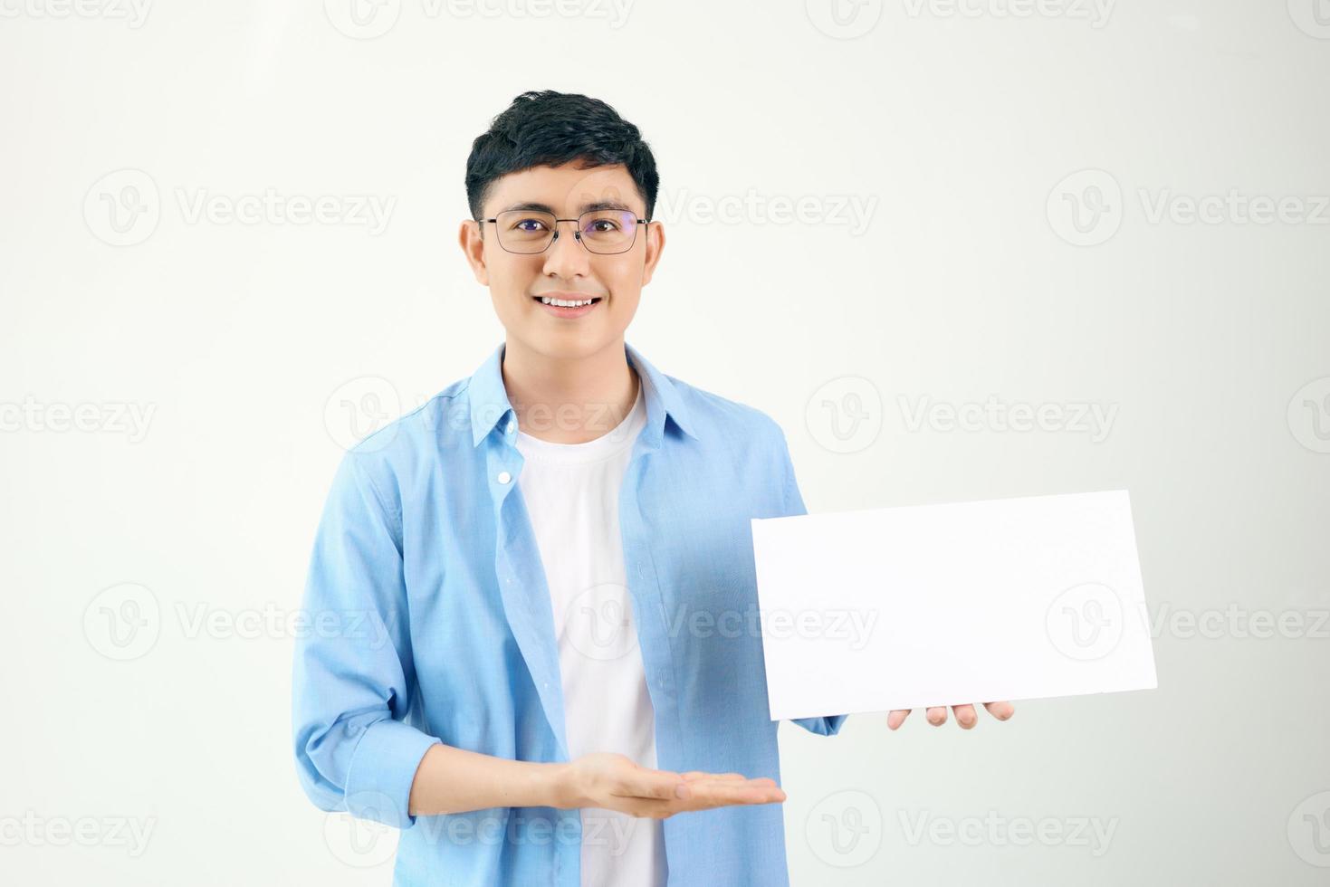 Asian young man showing pannel isolated on white background. photo