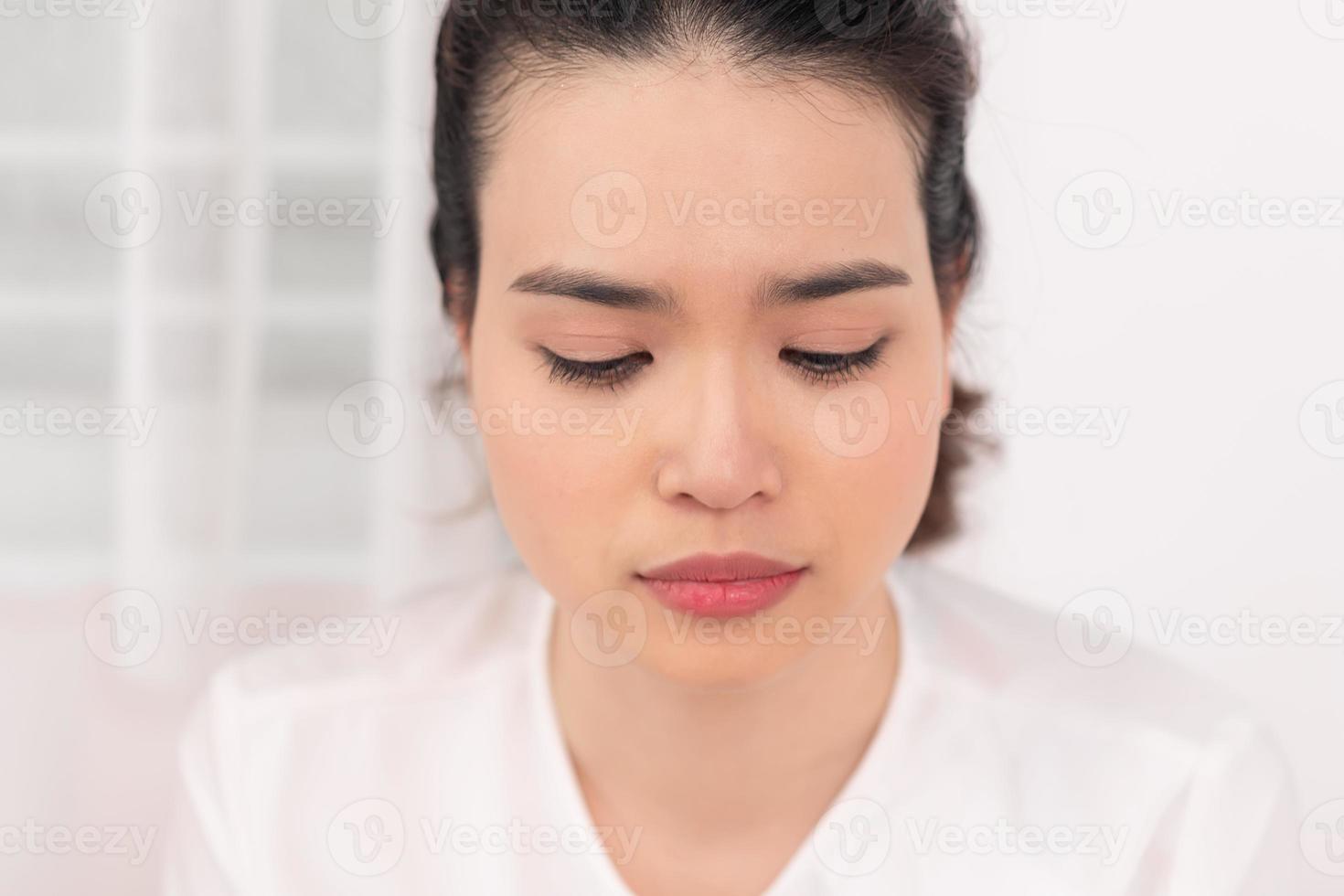 Young woman feel sick and unwell on bed photo