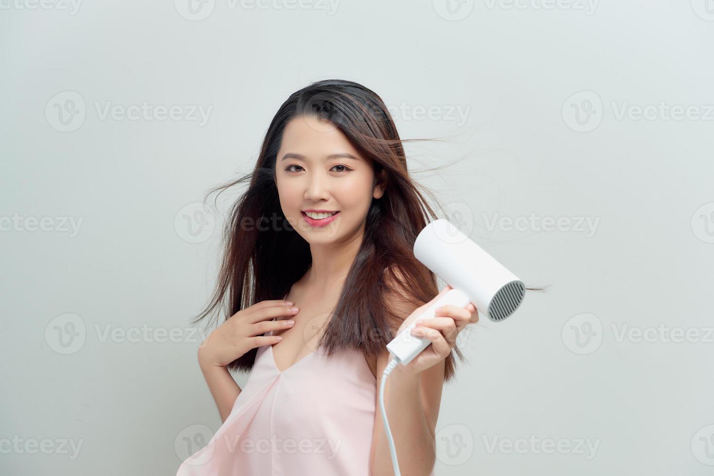 asian woman drying her hair photo