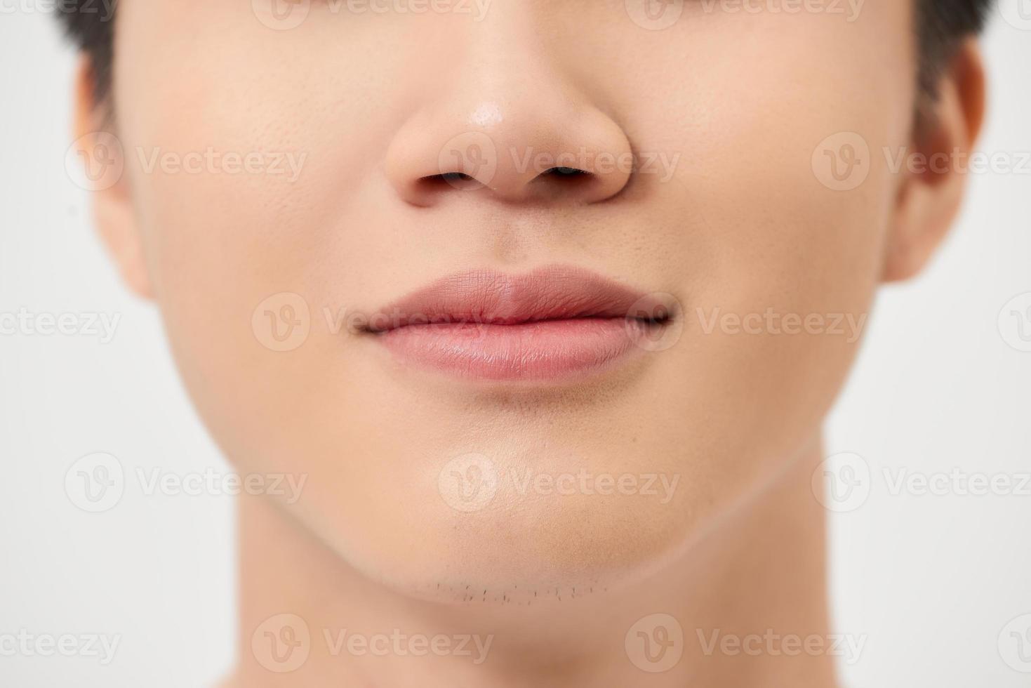 Close-up shot of a part of man's face. Isolated on white background photo