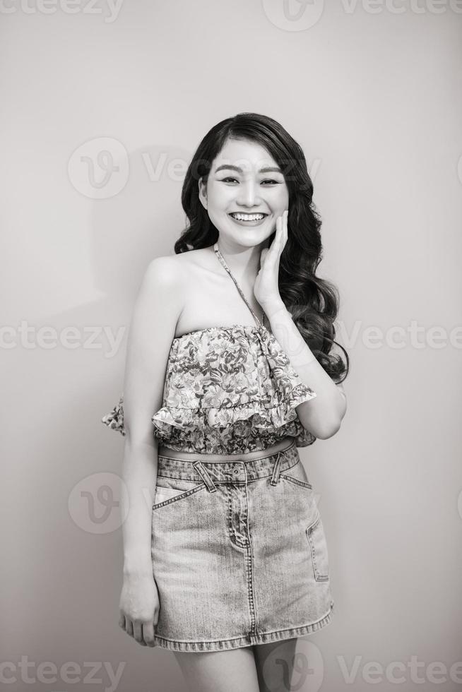 A young woman with creative hair style. Hard light in Black and white. photo