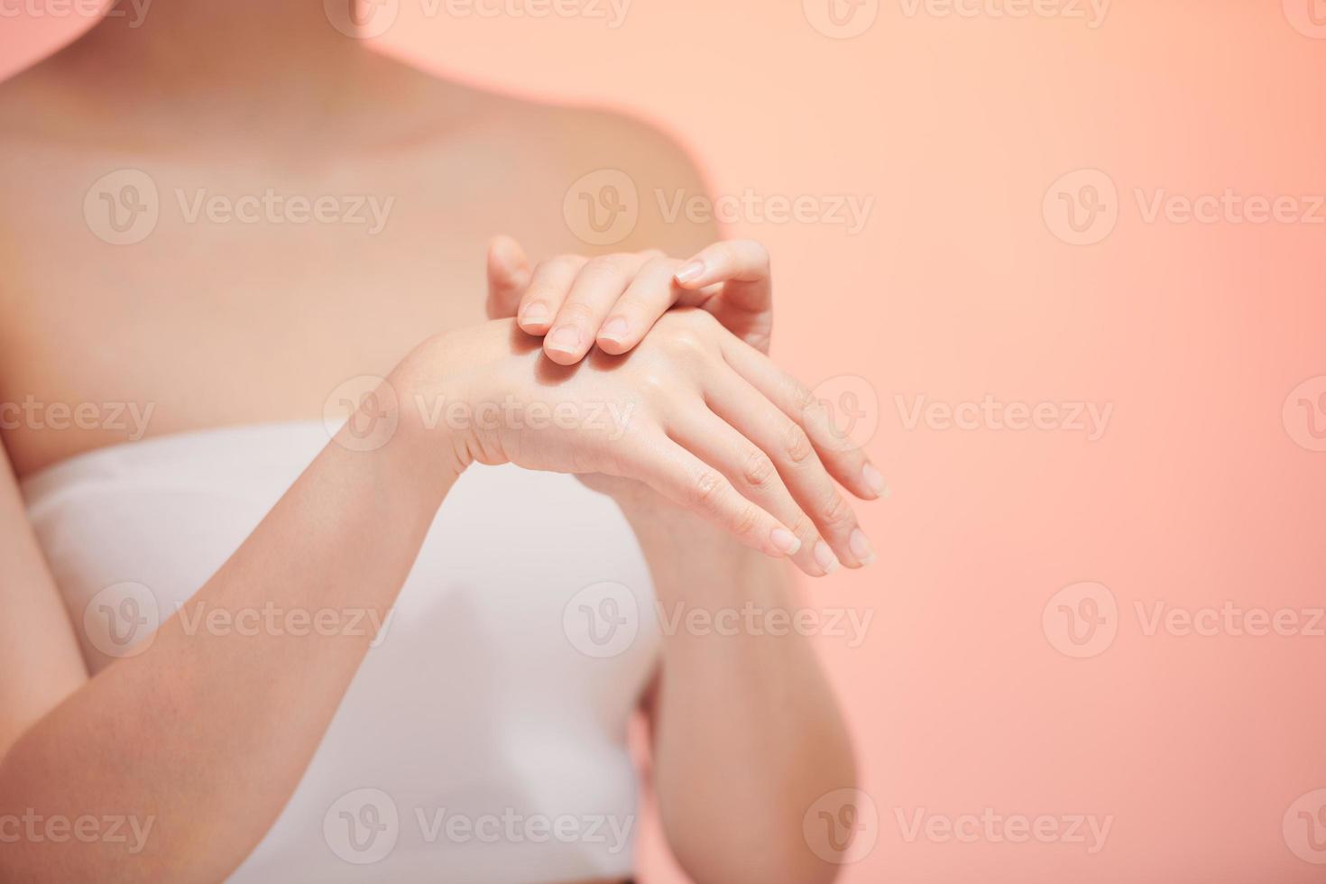 Beautiful woman's hands on the biege background photo