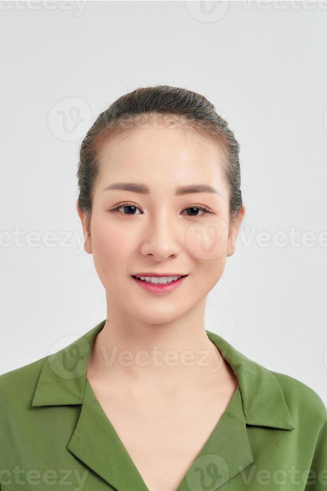 Portrait of elegant young Asian woman isolated over white background. photo