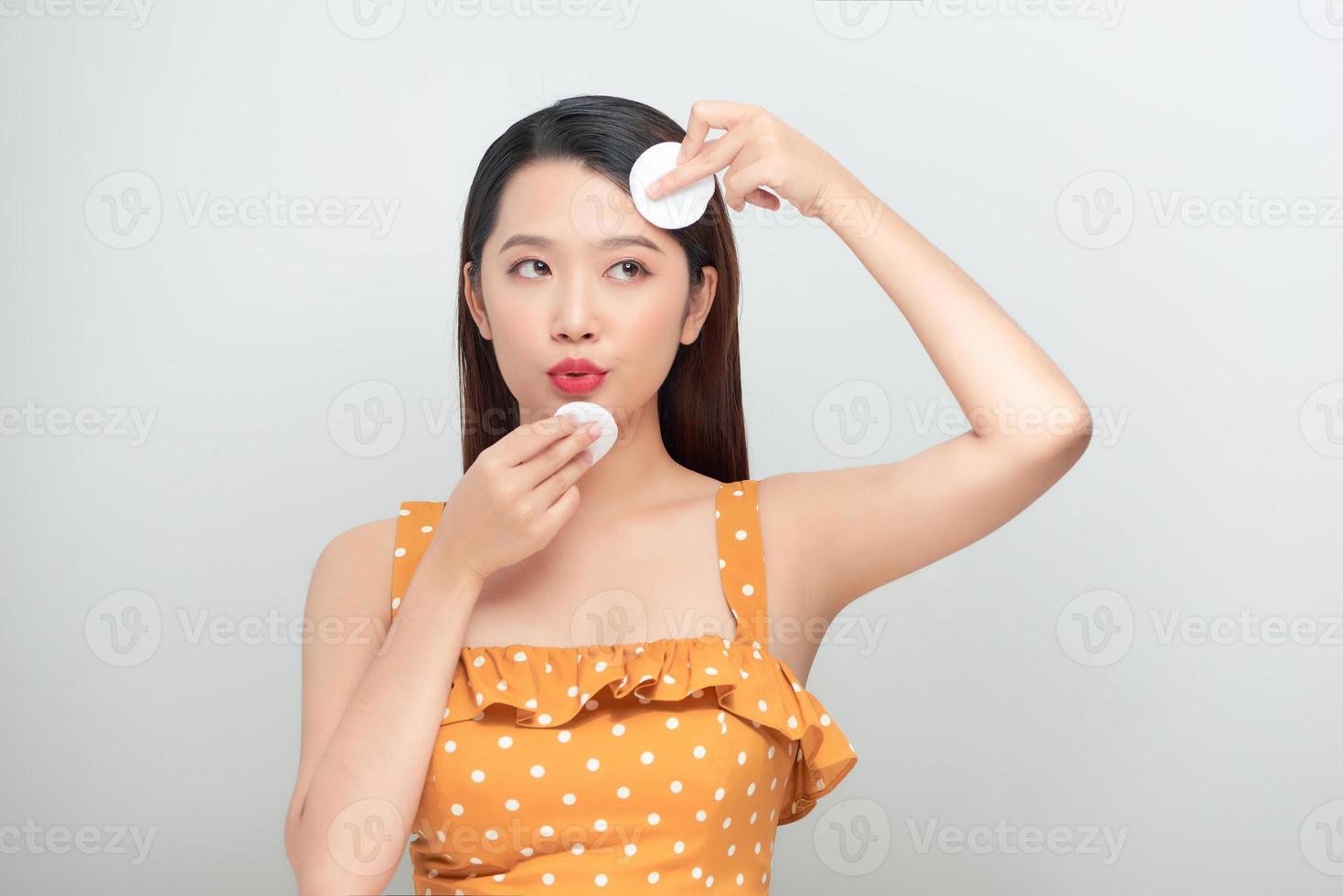 Lady Using Cotton Pads Applying Makeup Remover On Face