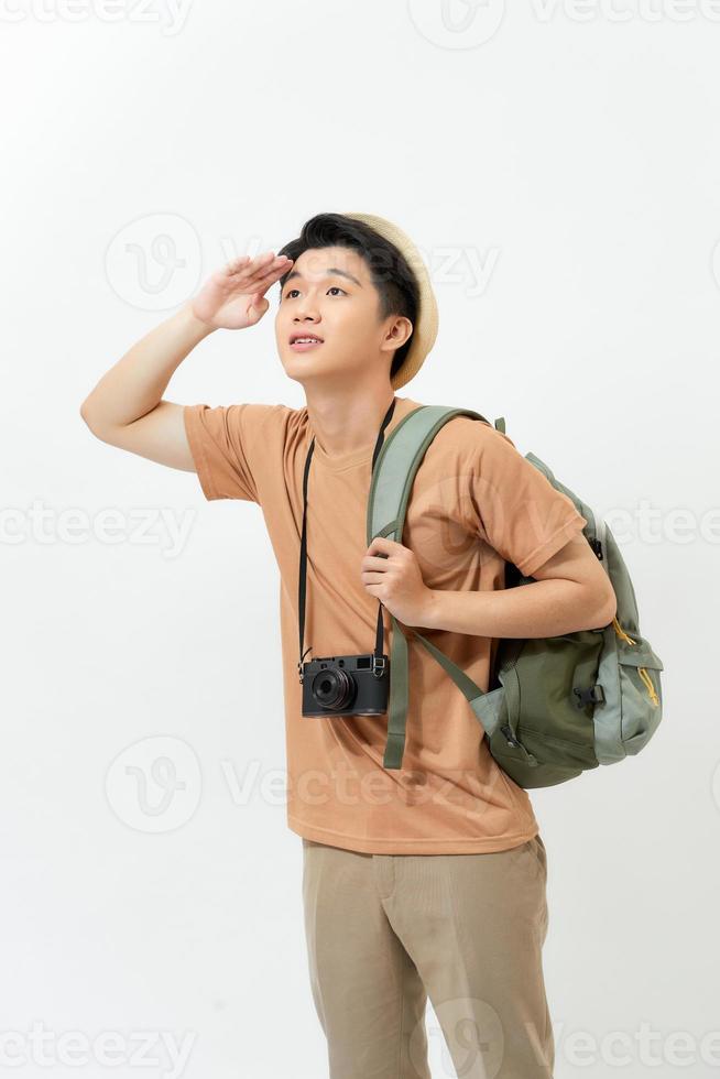 Asian tourist man looking away with hand on forehead isolated on white background photo