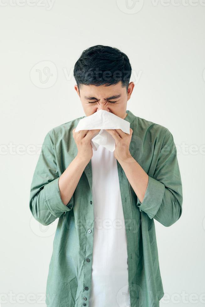 A man catches a cold, illness, asian photo