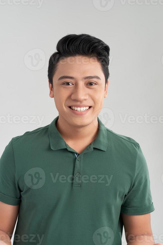 Close-up portrait of smiling handsome bearded man in white shirt looking at camera isolated on white background photo