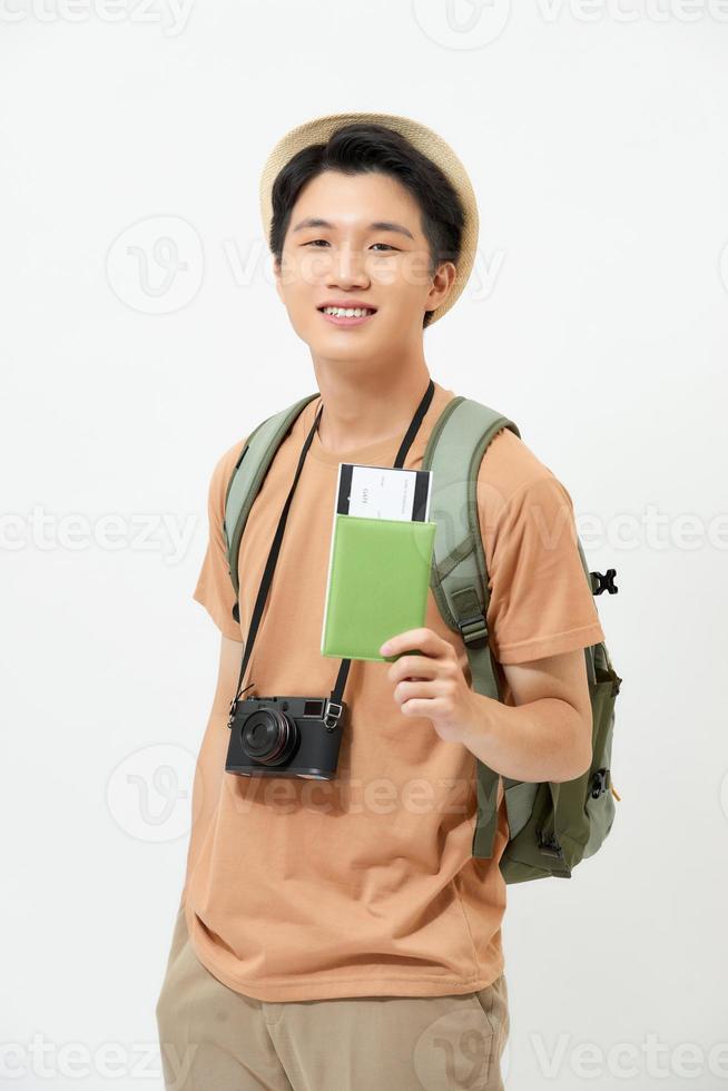 male traveler holds plane tickets and passport in hand photo