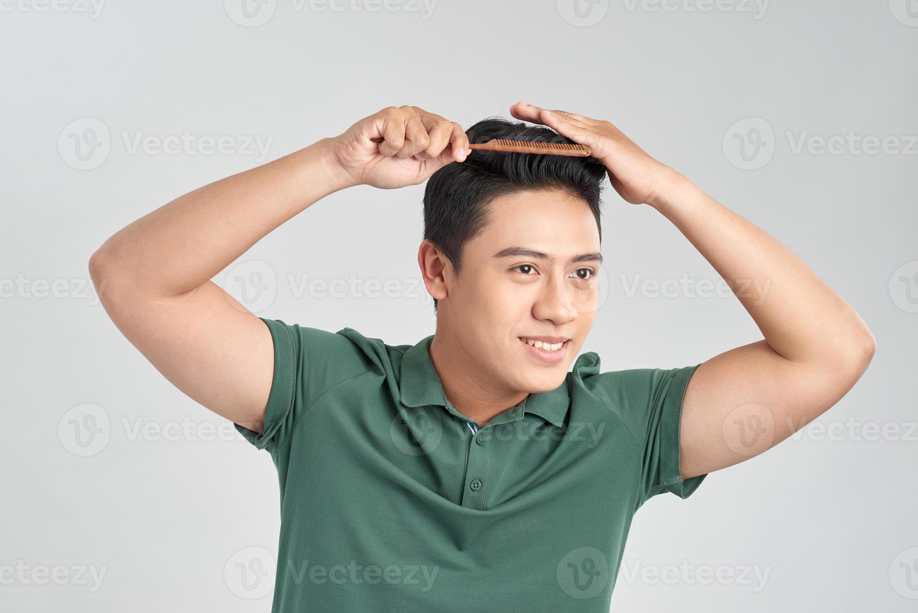 Closeup photo of macho cheerful mature guy holding hairbrush making hair  styling isolated white background 11138758 Stock Photo at Vecteezy