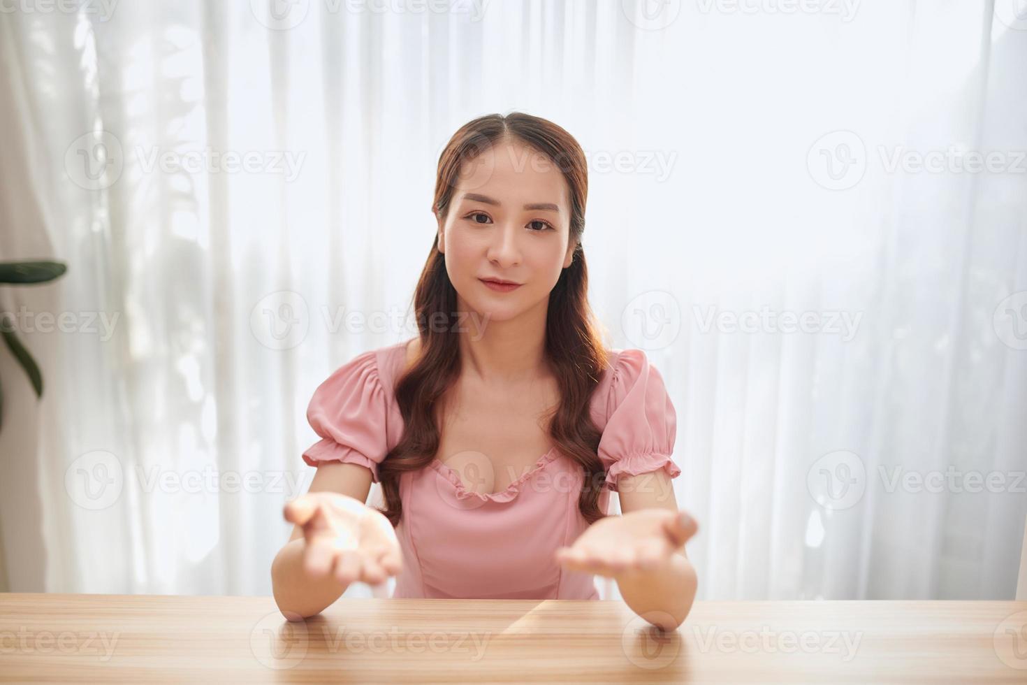 Portrait of young Asian woman blogger at home photo