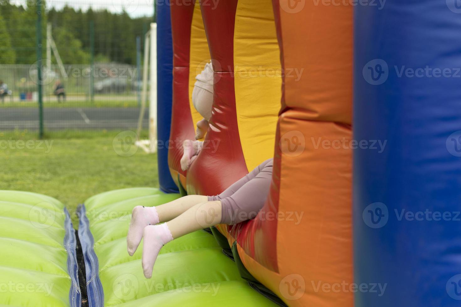 Child on obstacle course. Children's entertainment area. photo