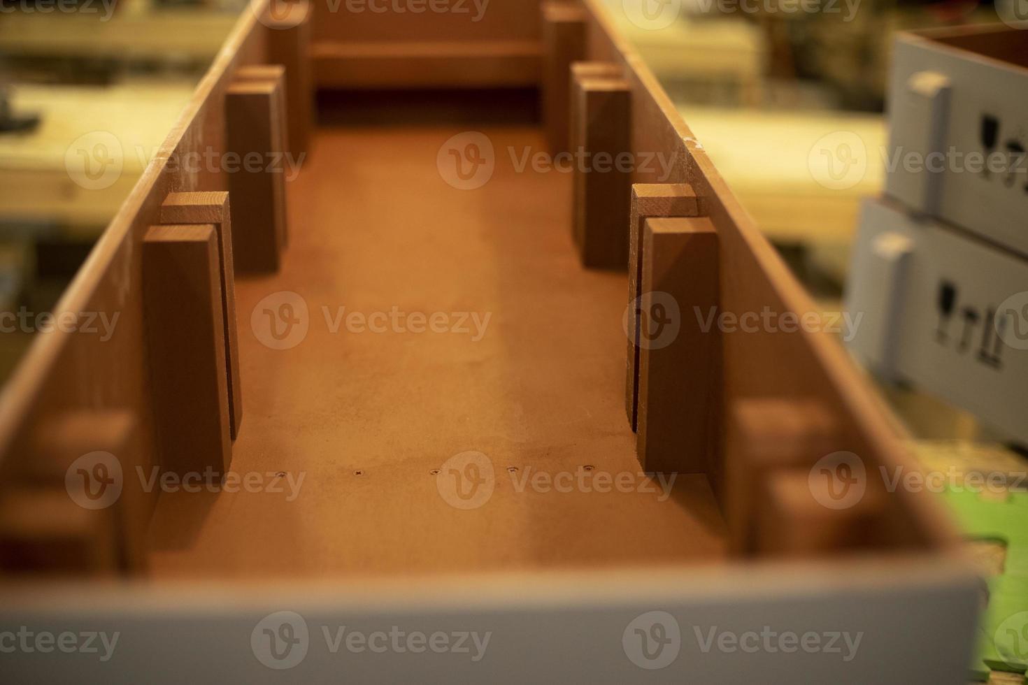 Production of wood boxes. Boxes in workshop. Wood processing shop. photo