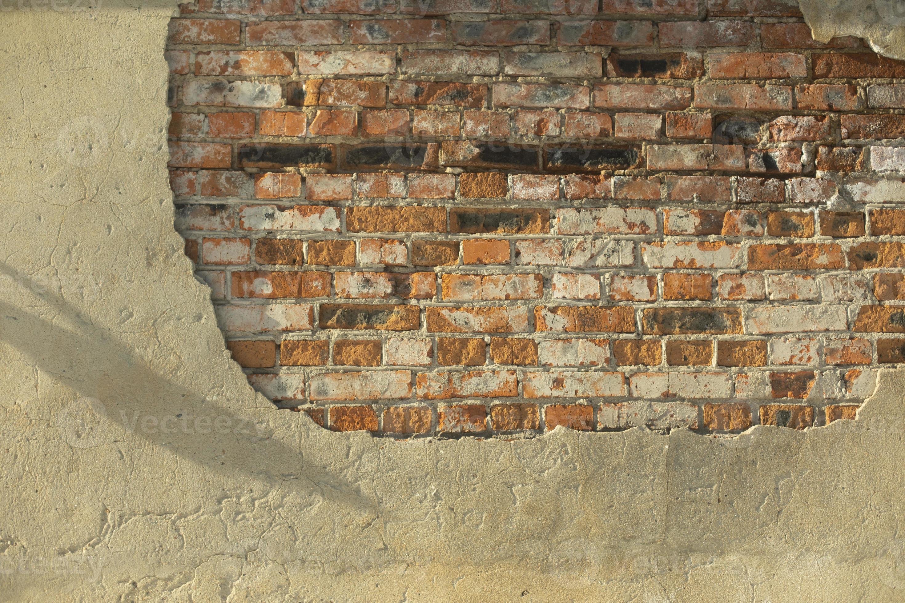 Brick wall. Broken plaster. Crumbling wall of house. 11141114 Stock Photo at Vecteezy