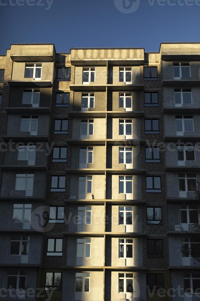 Building with windows. Urban development. Lots of apartment building. photo