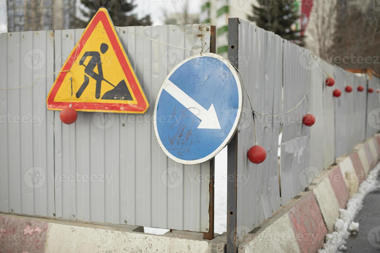 Place of construction. Building signs on fence. Place of fencing. photo