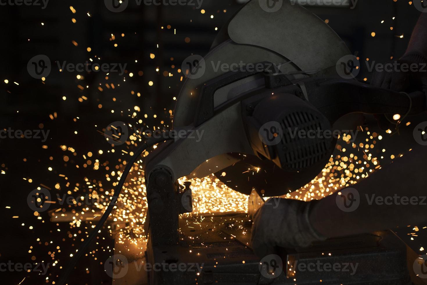 Sparks from welding. Metal cutting. Production details. photo