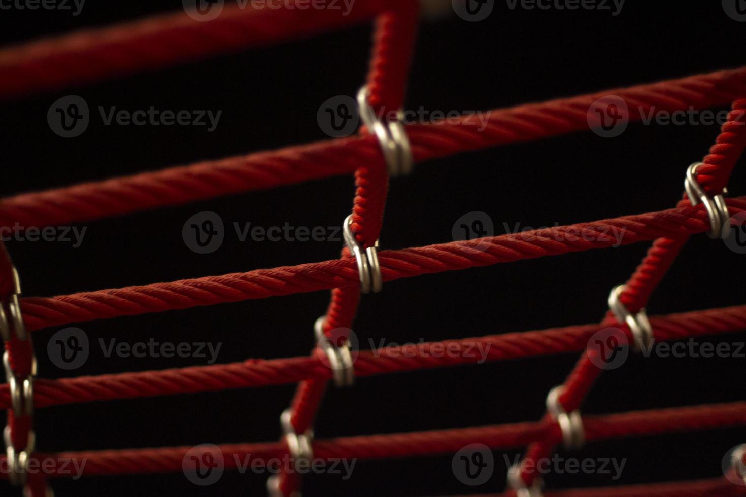 Ropes in the playground. Climbing net, shot close-up. Ropes fastened with links. photo