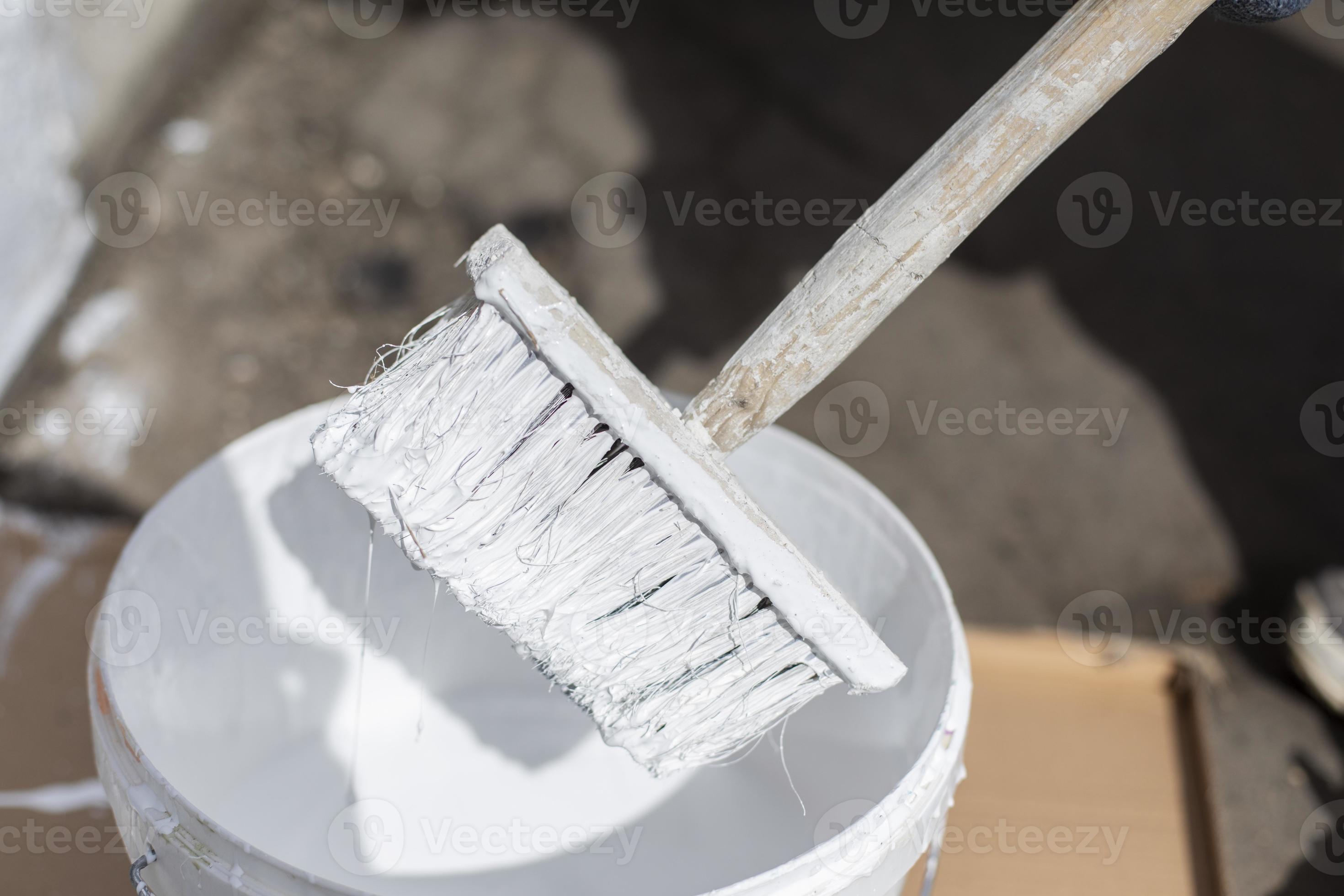 White paint and brush. Painting tool. Bucket of white paint. 11141883