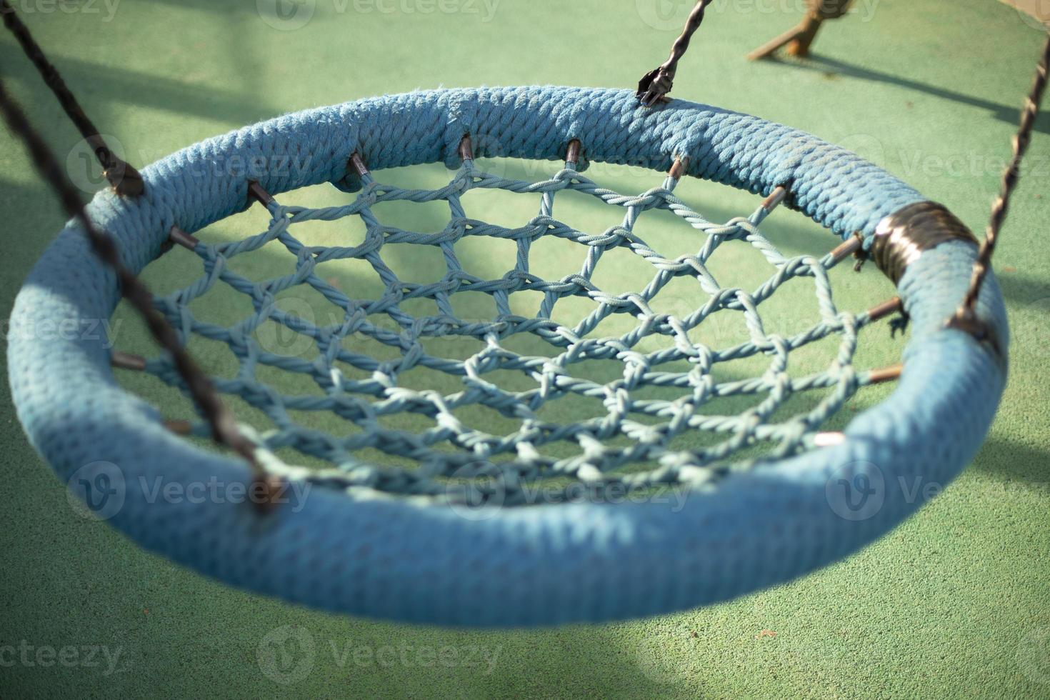 Round swings for children. Swings on ropes. photo