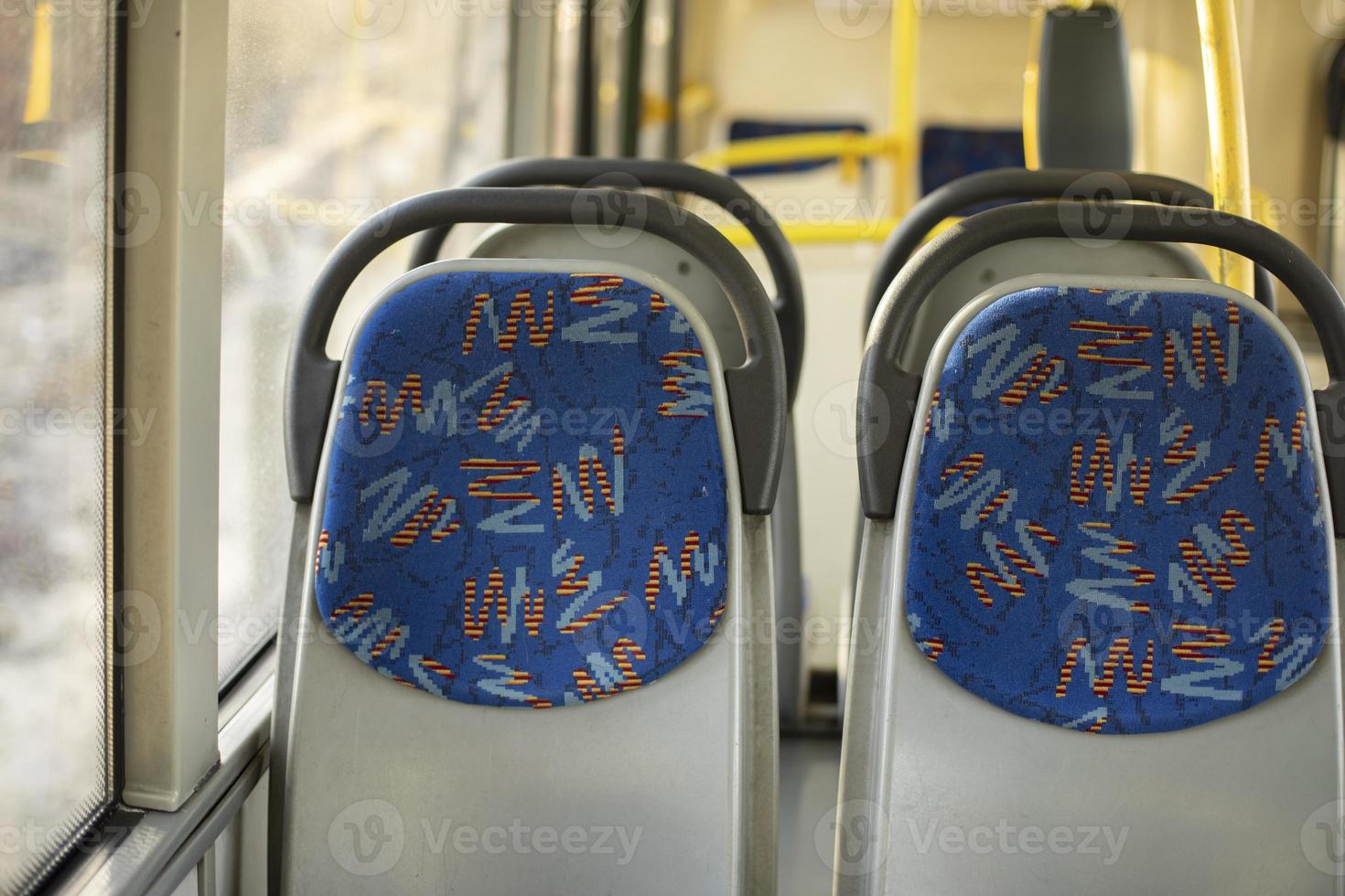 Seats on bus. Empty seats in transport. Seats for passengers. photo