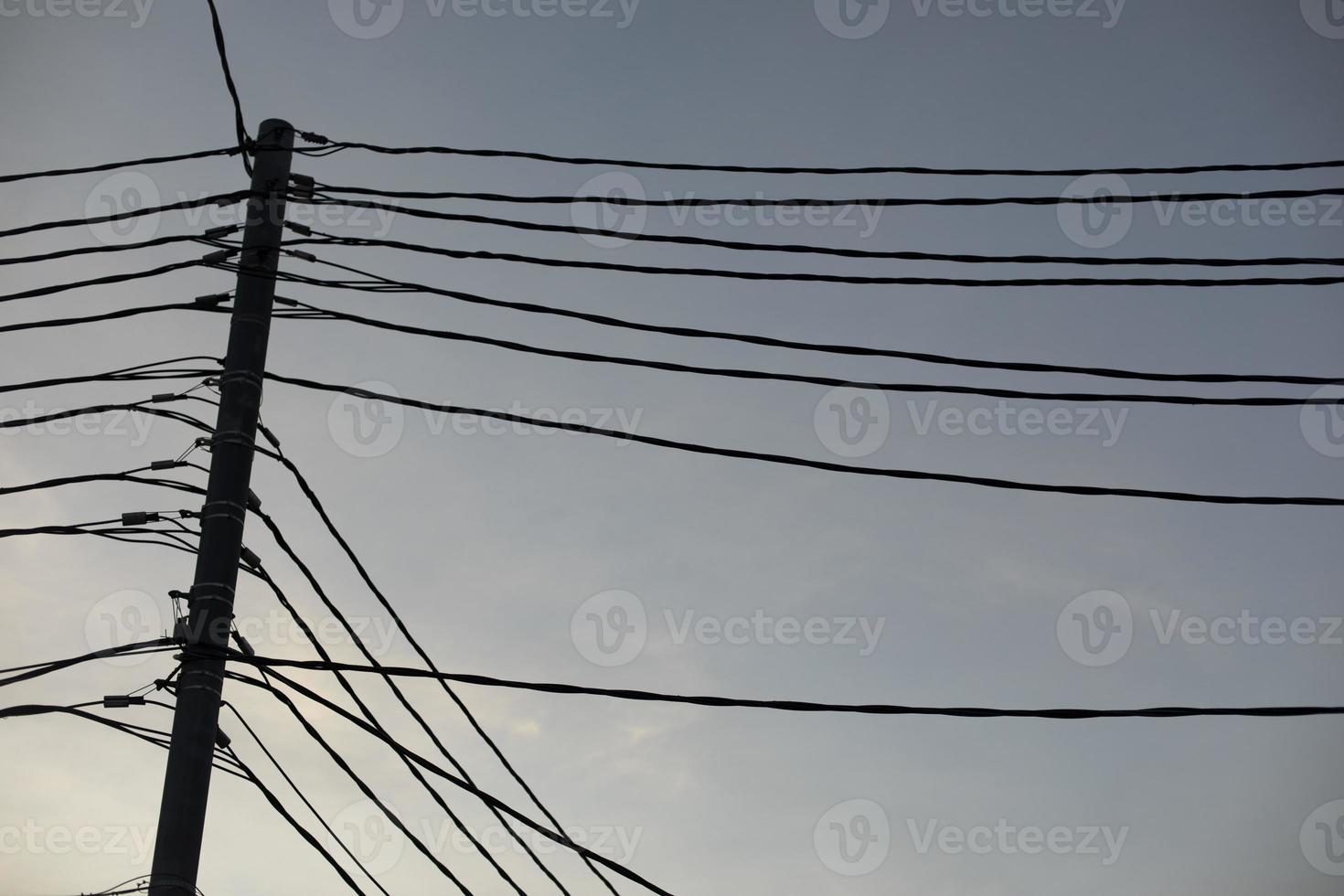 Wires against sky. Lots of electrical wires. photo