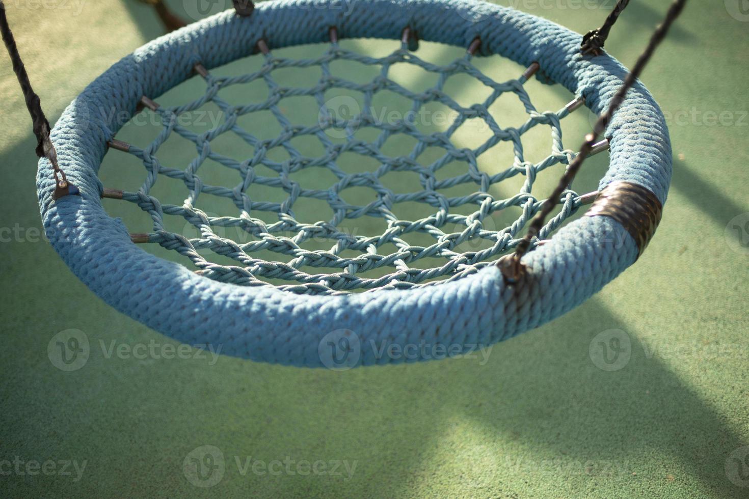 Children's swings of round shape. Rope swings. photo