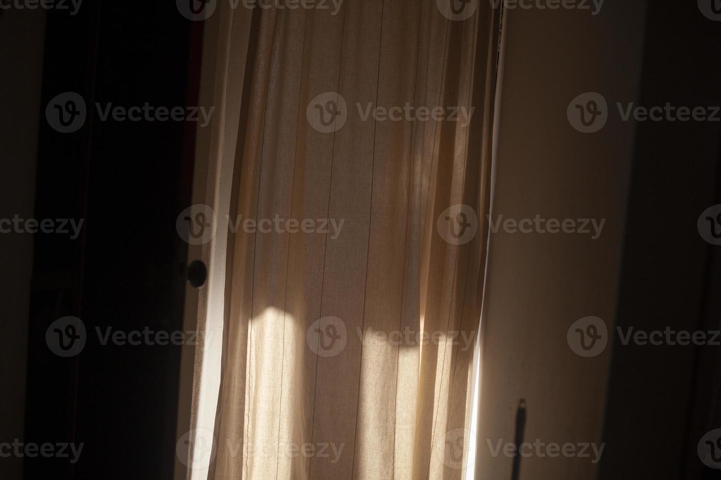 Light on fabric. Peach blossoms in curtains in sun. photo