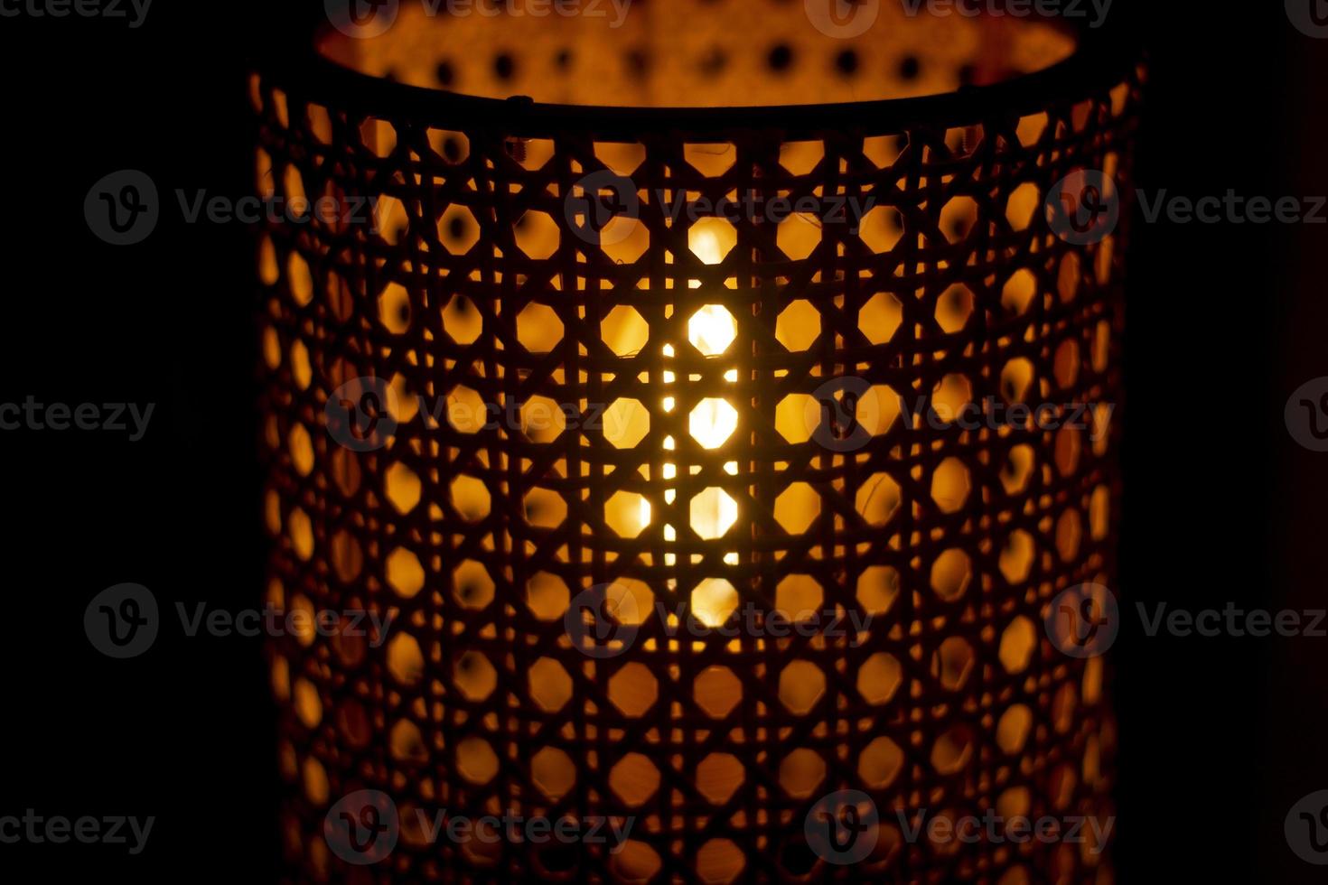 Wooden lamp. Lampshade for incandescent lamp. Light in dark. photo