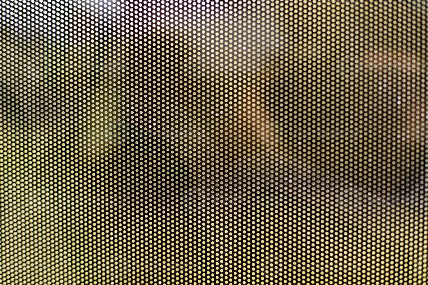 Mesh texture on glass. Shooting window. Small cage. photo