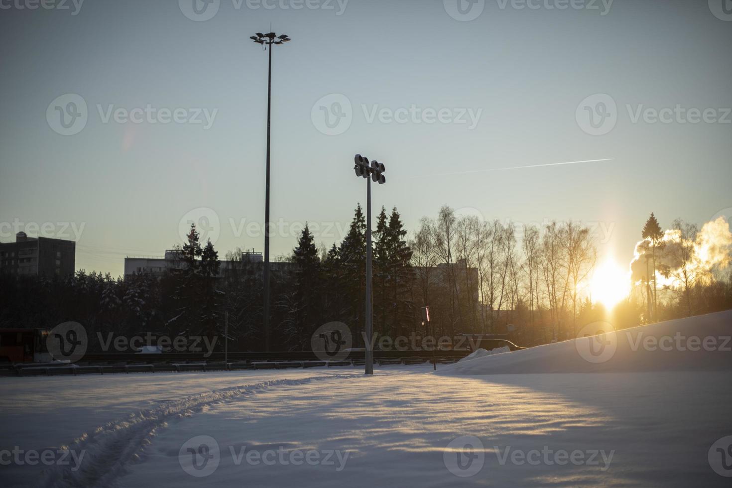 Cityscape in winter. View of snowy field. photo