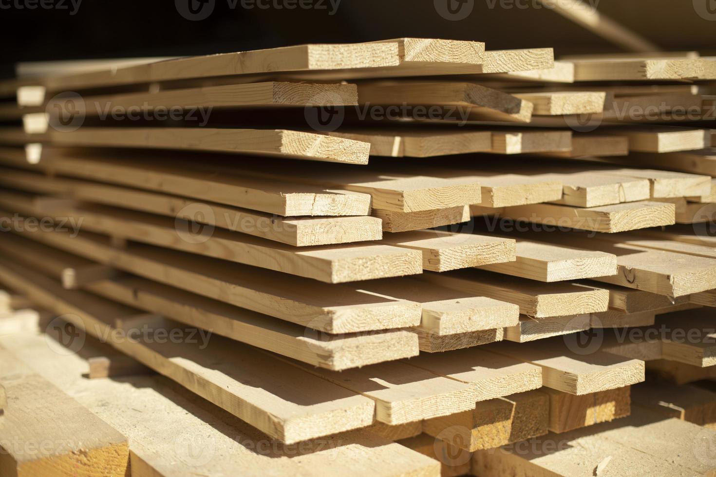 Boards in stock. White boards lie in stack. photo