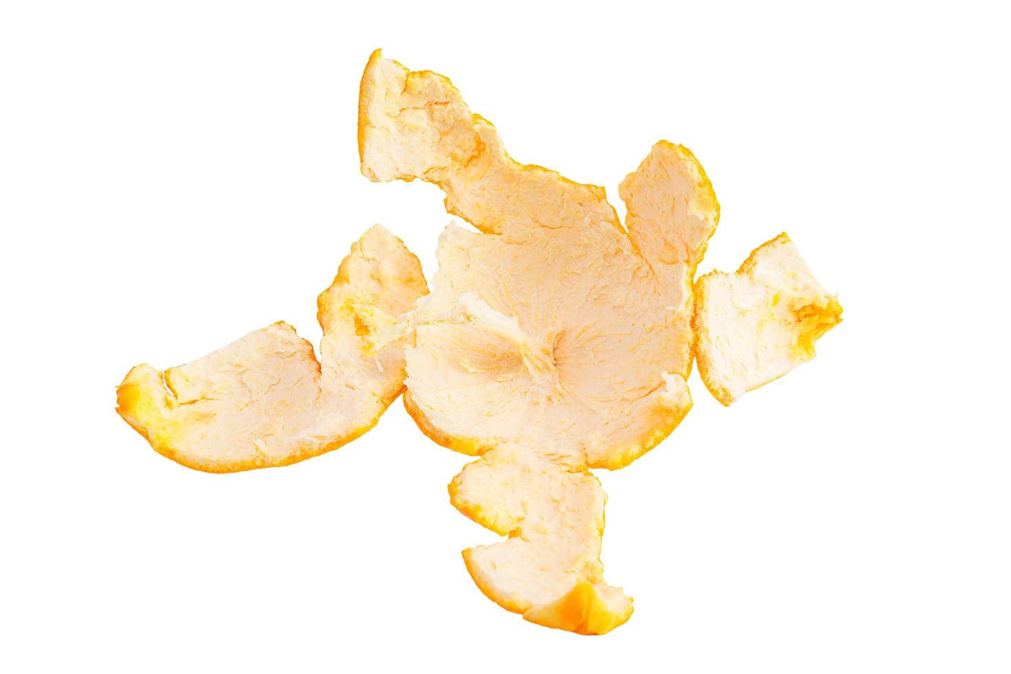 Orange peel against white background photo