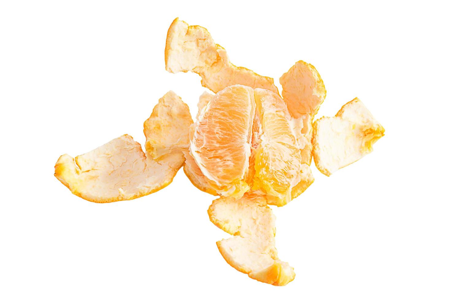 Orange posed on a orange peel against white background photo