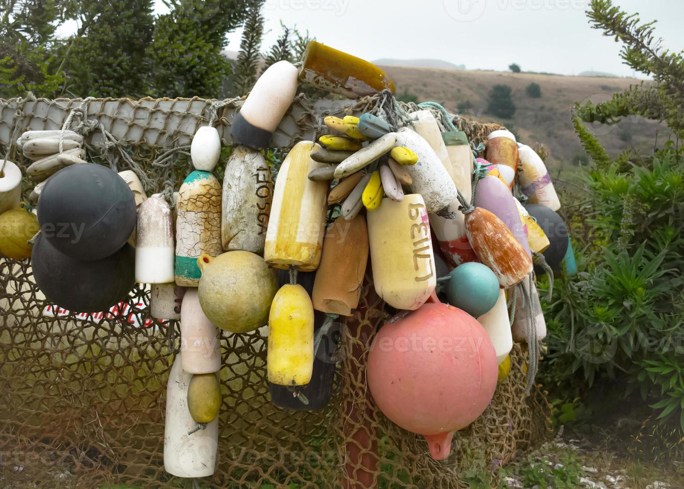 Colorful Vintage Buoys by the Sea photo