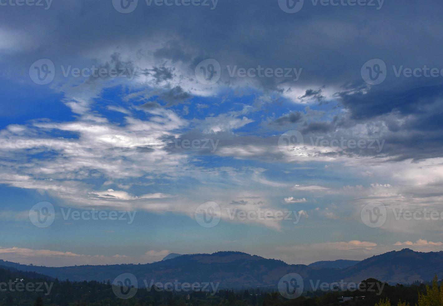 Dreamy Cloudy Sky Over Mountains photo