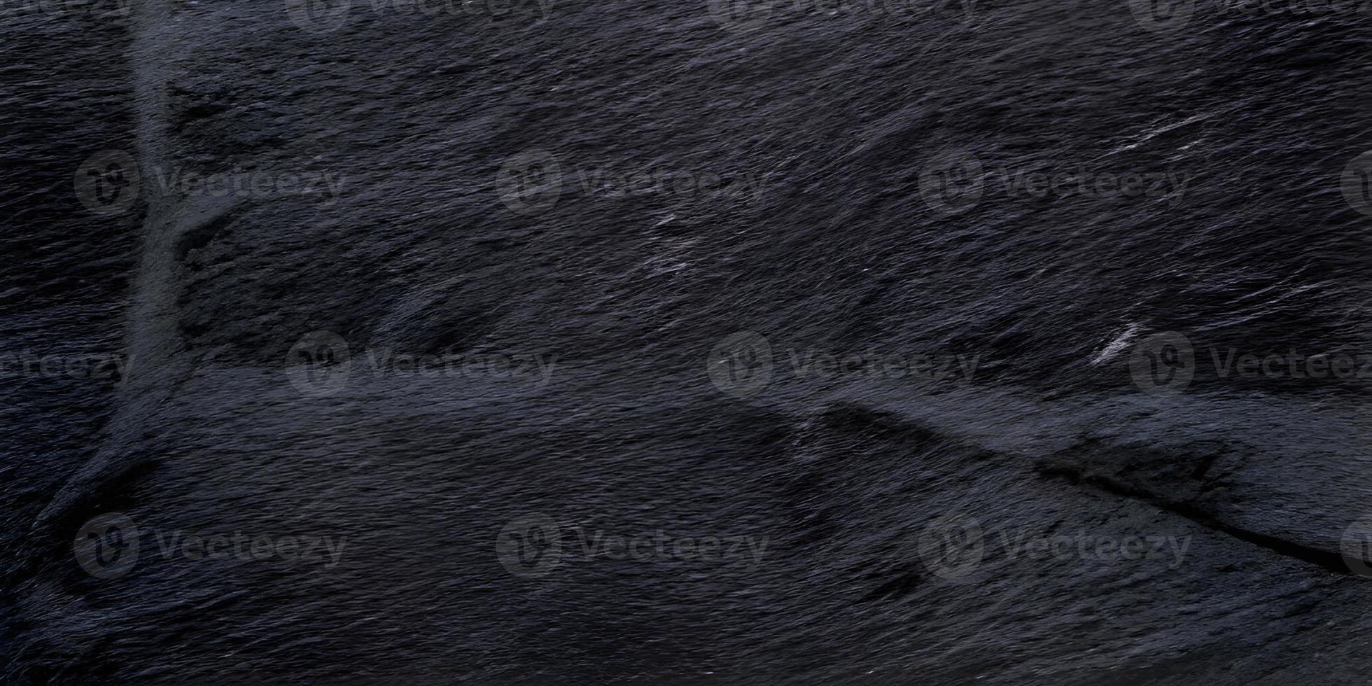 black brick wall of dark stone texture and background, stone floor wide picture photo