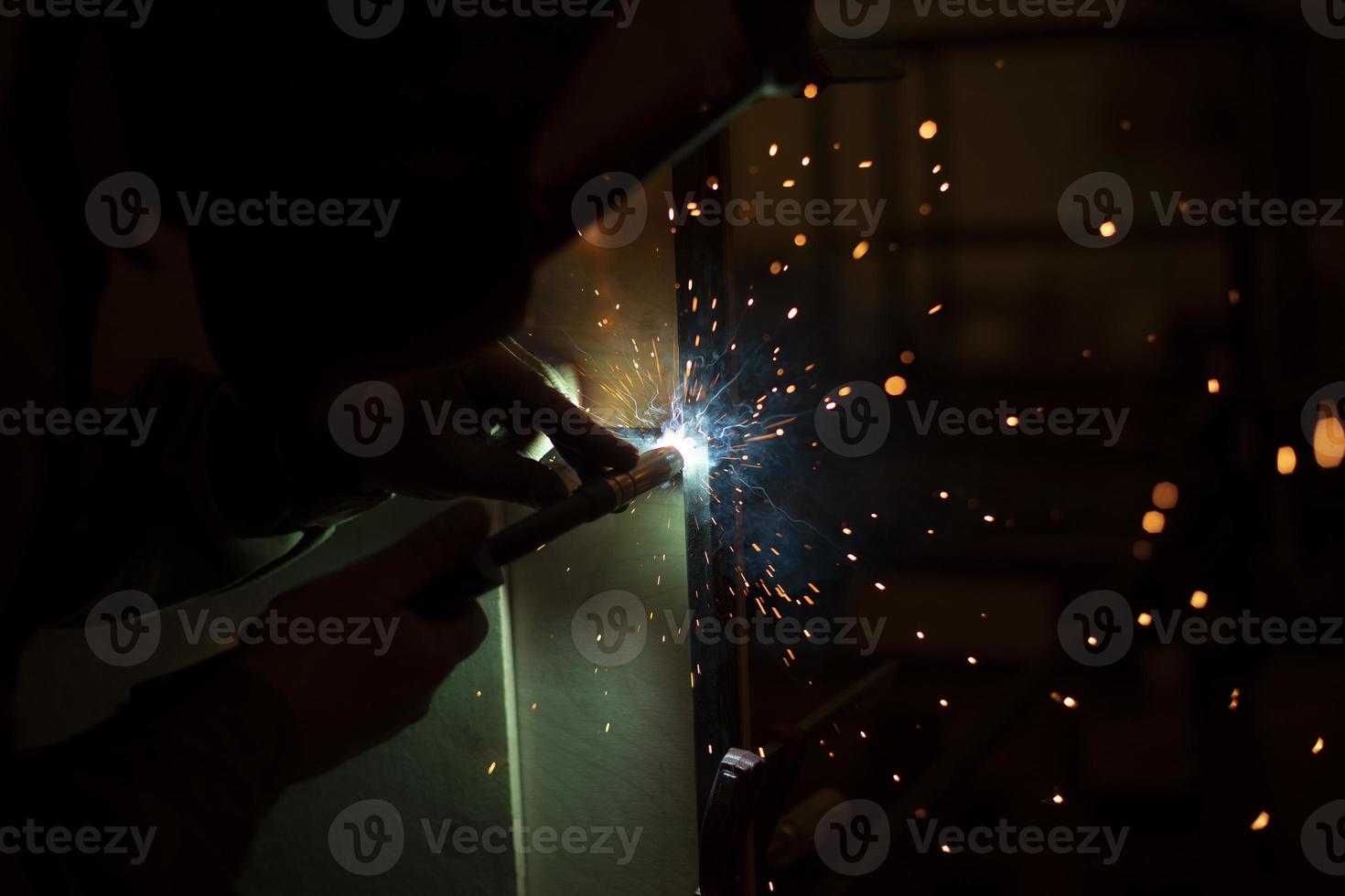 Welding work. High temperature. Hot steel. Metal welding. Production details. photo