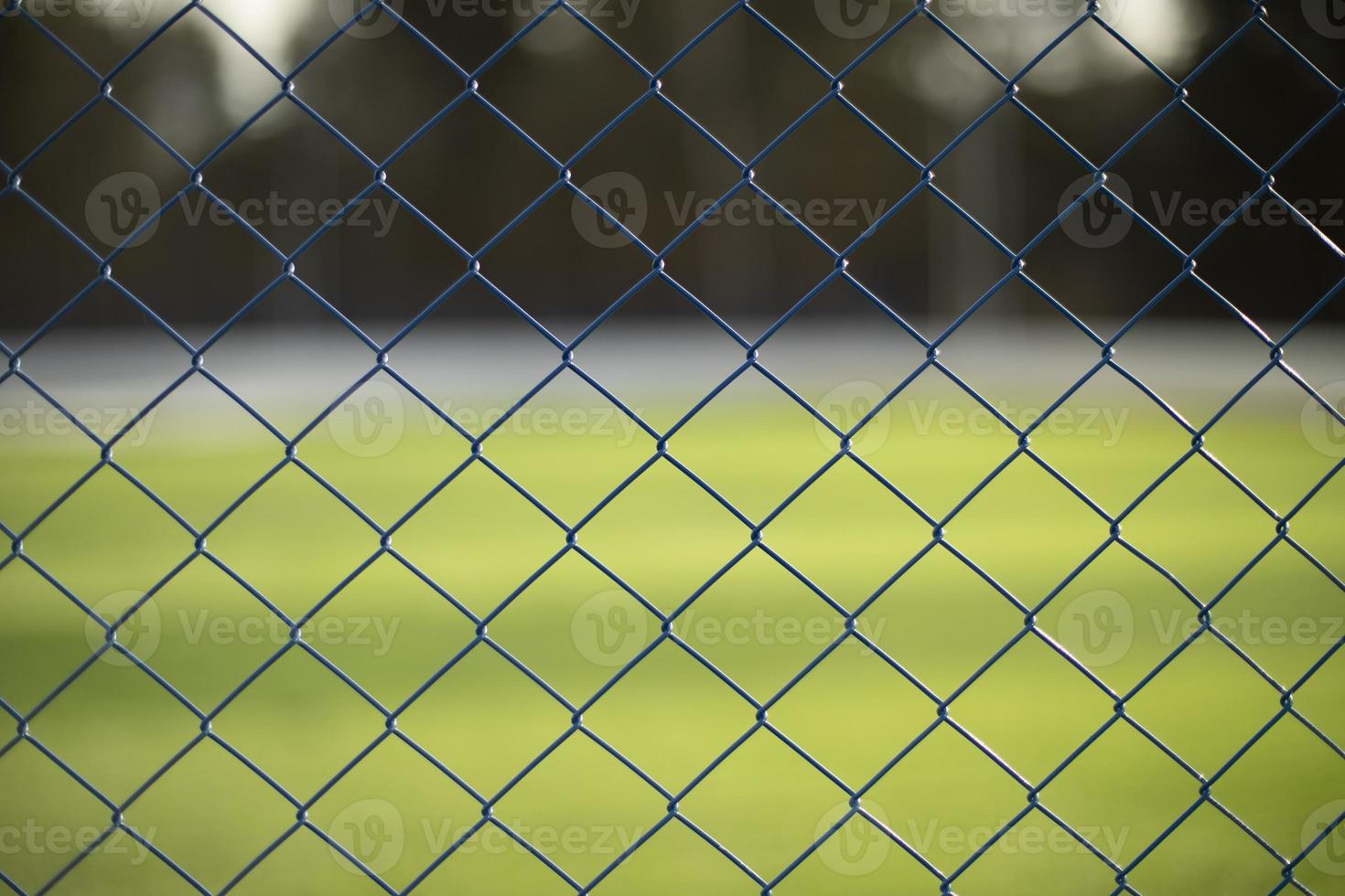Fence net. Fence on green background. photo