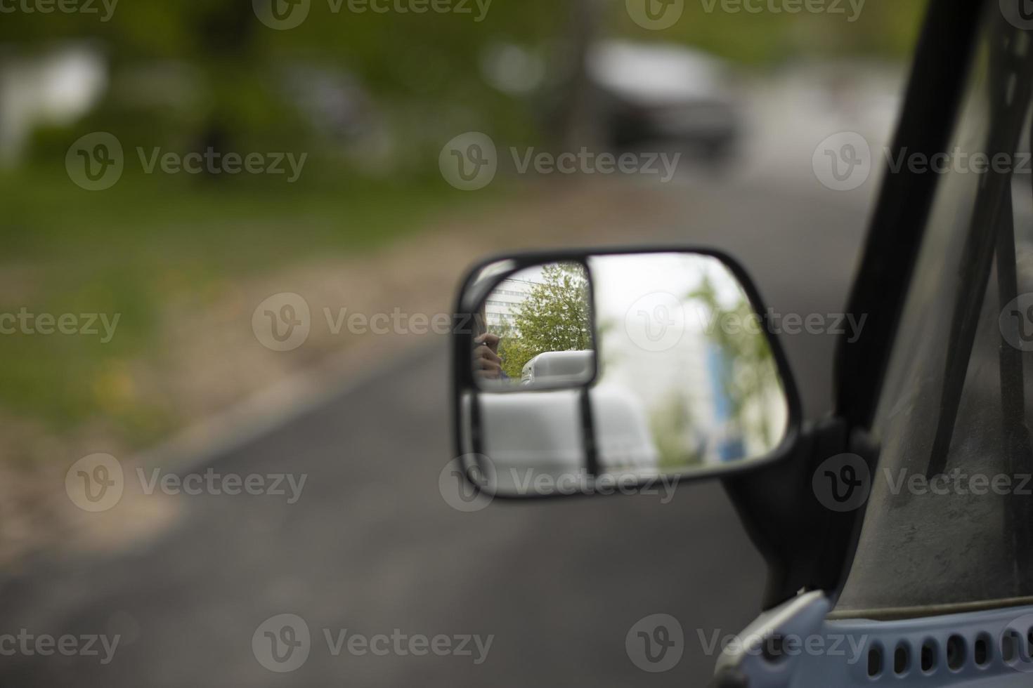 Rear-view mirror of car. Mirror to monitor road. Observation tool. photo