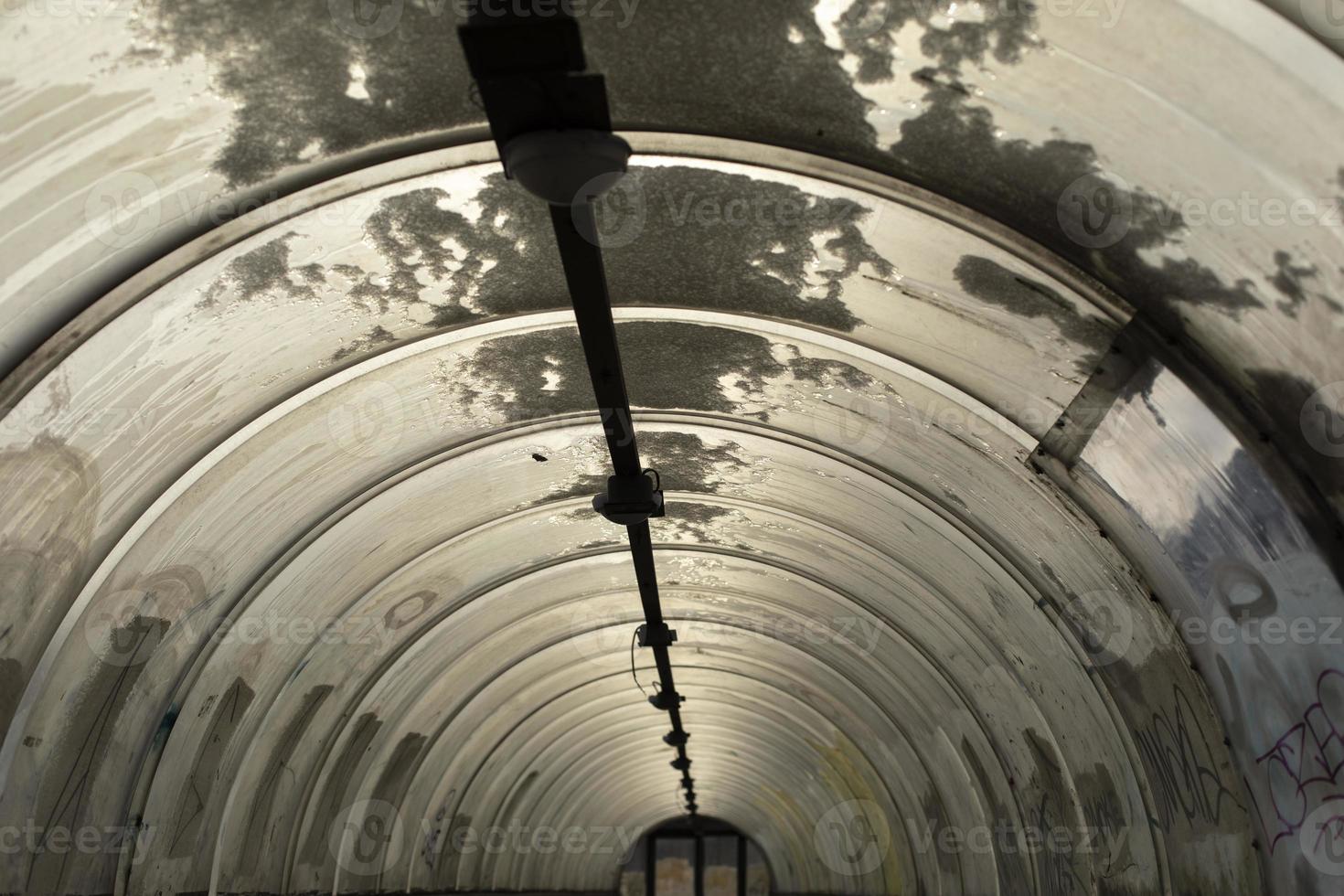 Tunnel made of plastic. Snow on dome. Outgoing perspective. photo