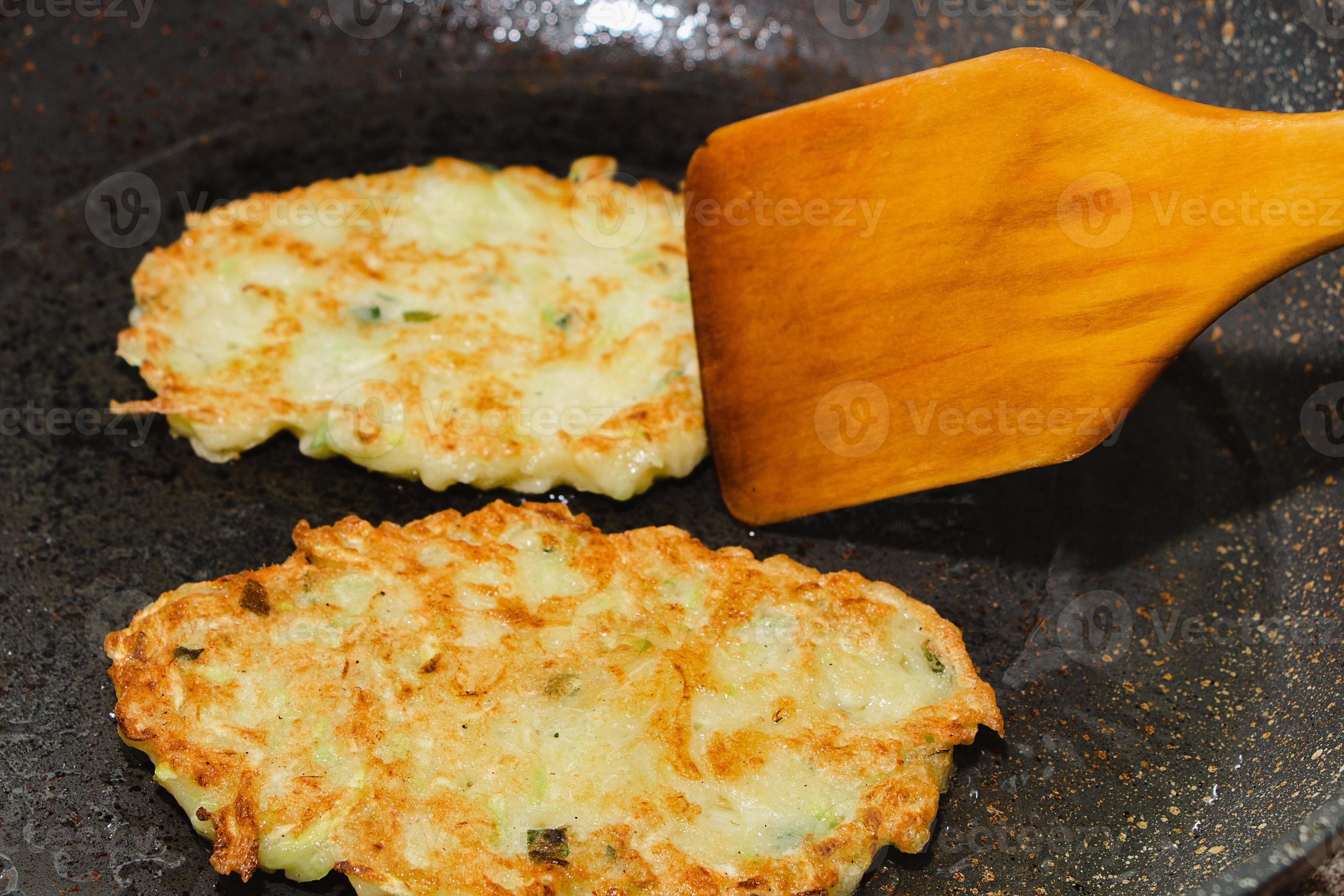 Recipe for zucchini fritters. Step 5 fry pancakes in pan until golden