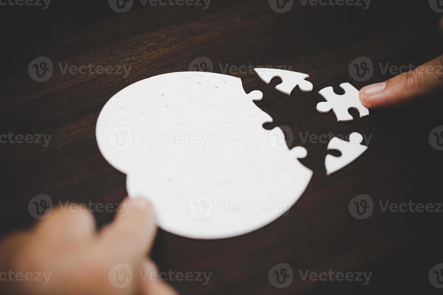 Business woman person hand with puzzle piece idea for strategy and solution. Closeup part of two white jigsaw connect together. Concept of join cooperation success teamwork-problem corporate team. photo