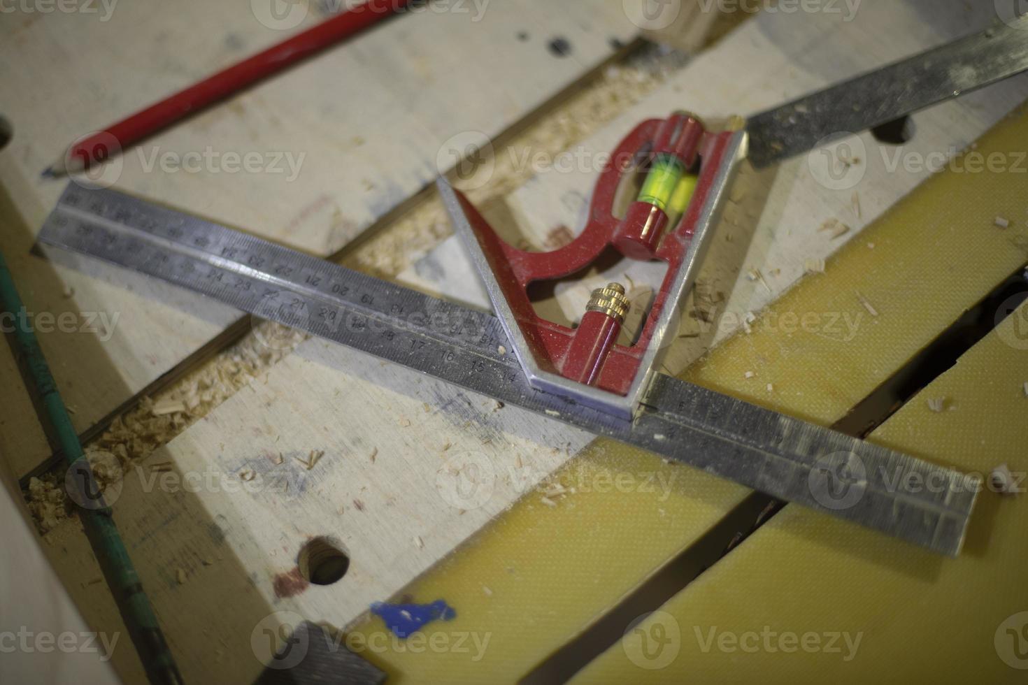 Line and level in workshop. Tool for measurements. Details of carpentry. photo