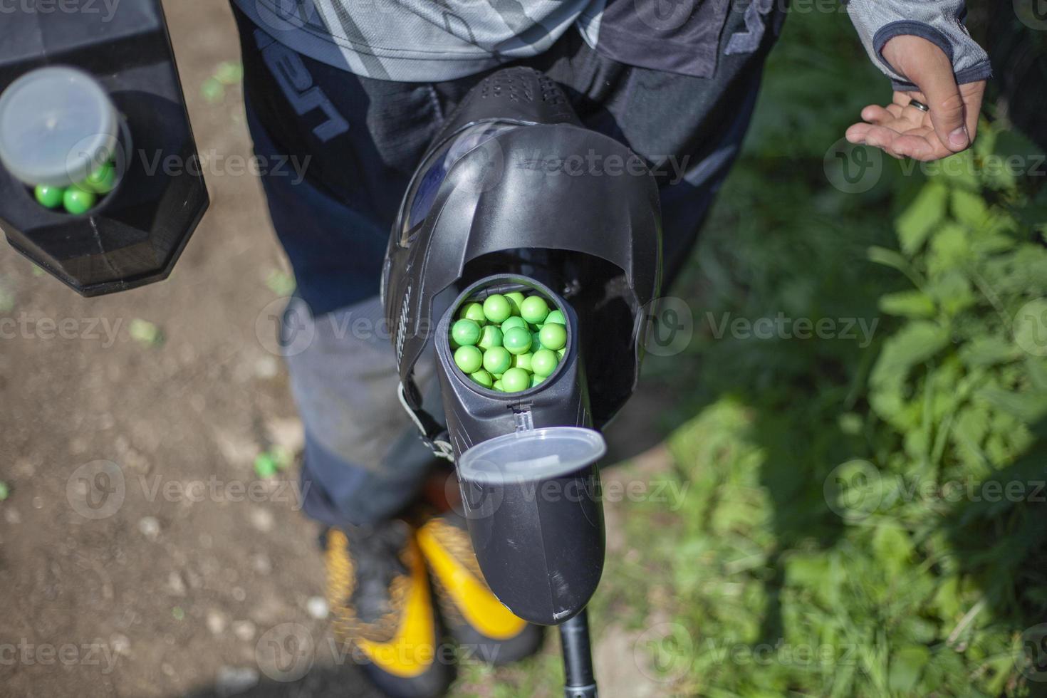 Balls with paint in jar. Sports equipment. photo