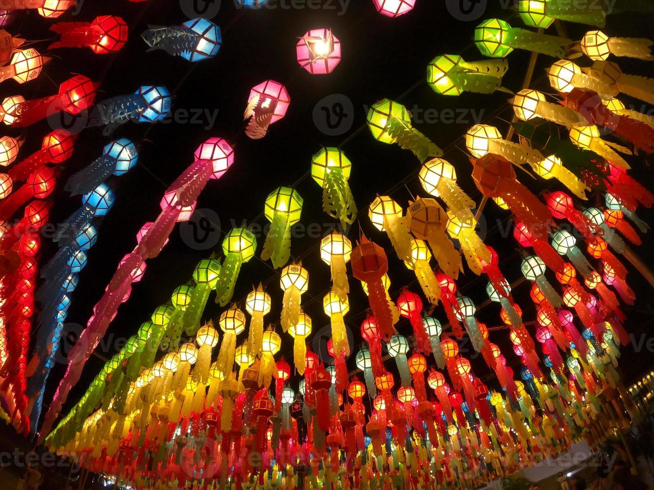 Colorful look up and bottom view of Thai Lanna style lanterns to hang in front of the temple on night time in Loy Kratong Festival. photo