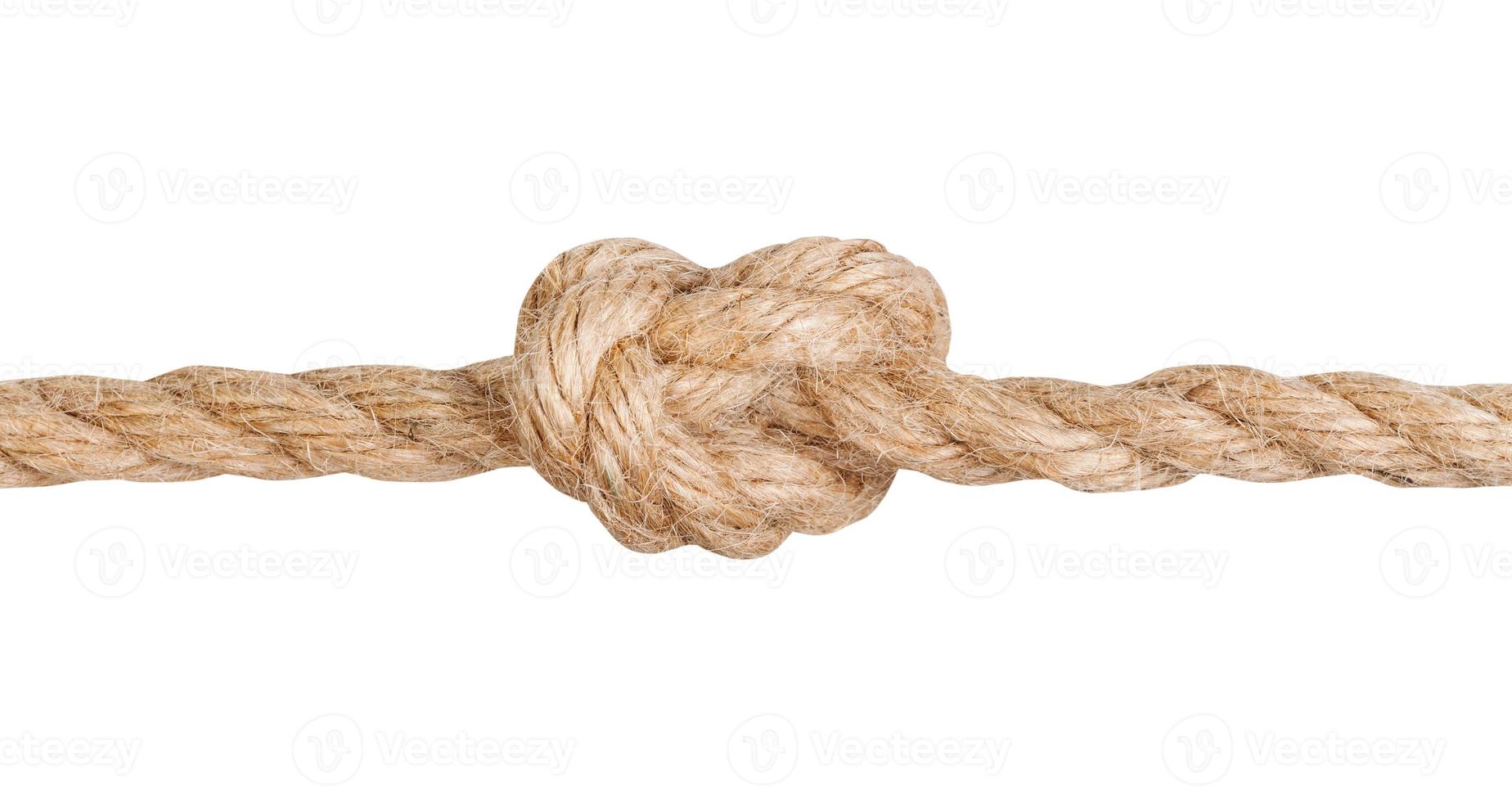 Overhand knot tied on thick jute rope isolated photo