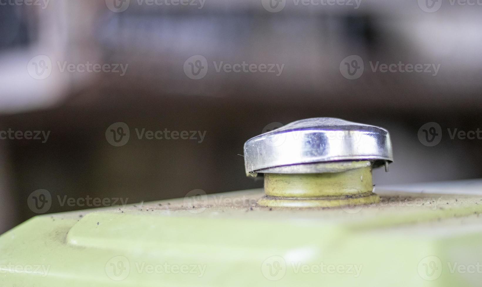 Stainless steel fuel tank cap on the fuel tank. The concept of rising fuel prices in the world. photo