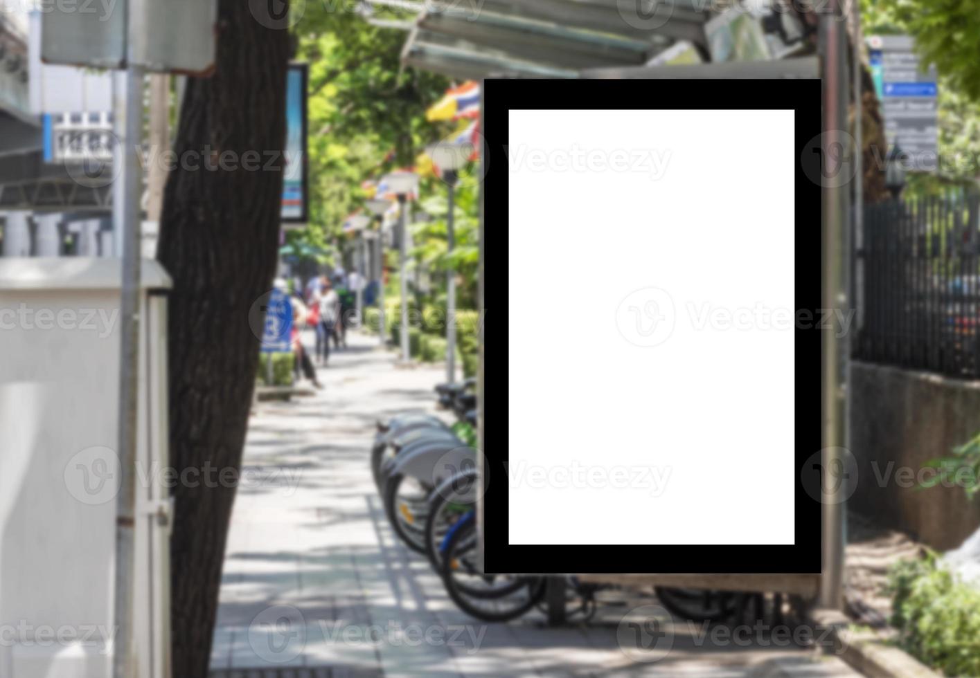 Outdoor billboard with mock up white screen on bus stop and clipping path photo