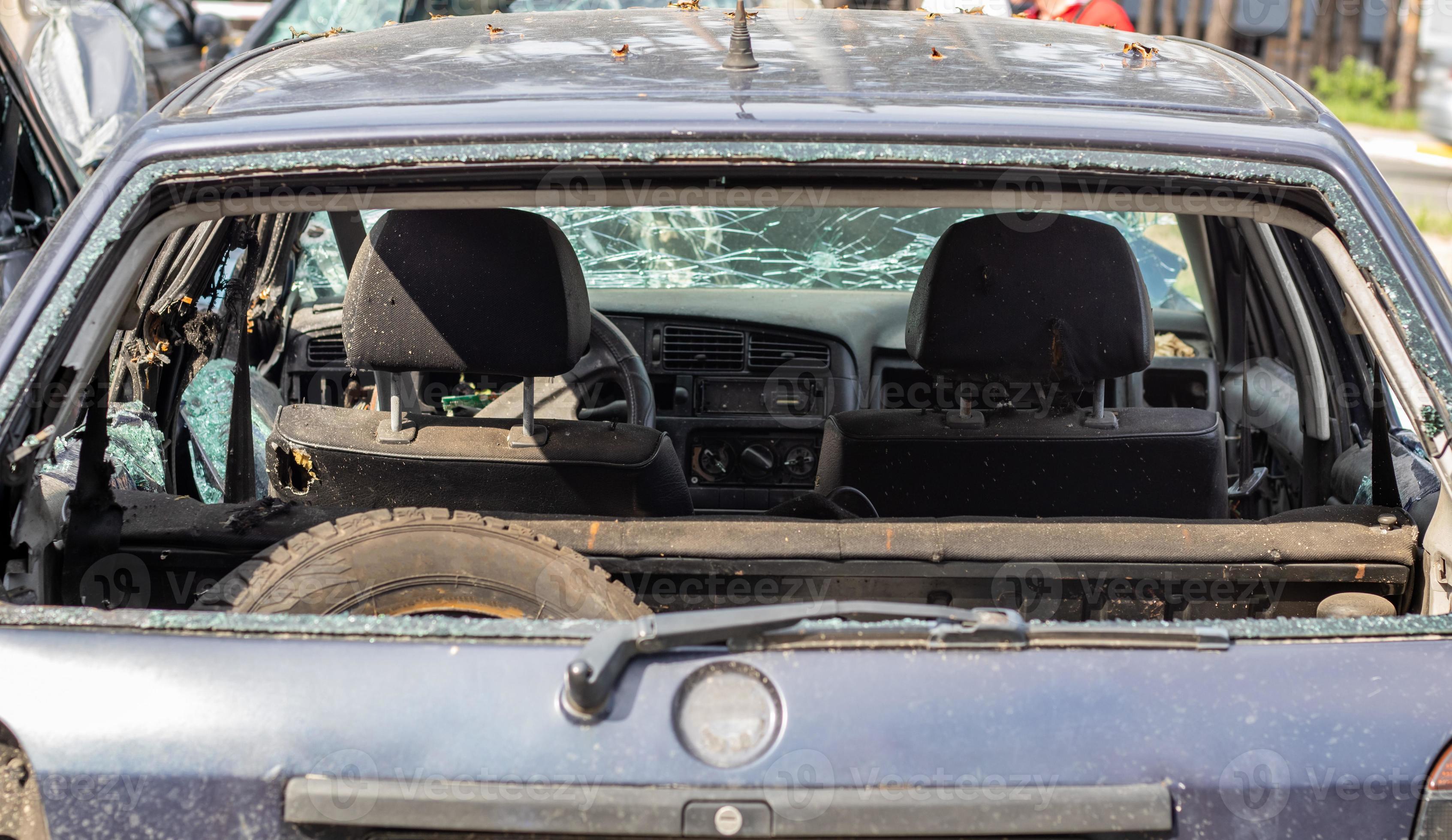 A car after an accident with a broken rear window. Broken window in a